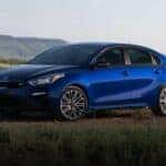 Blue 2020 Kia Forte parked in a field