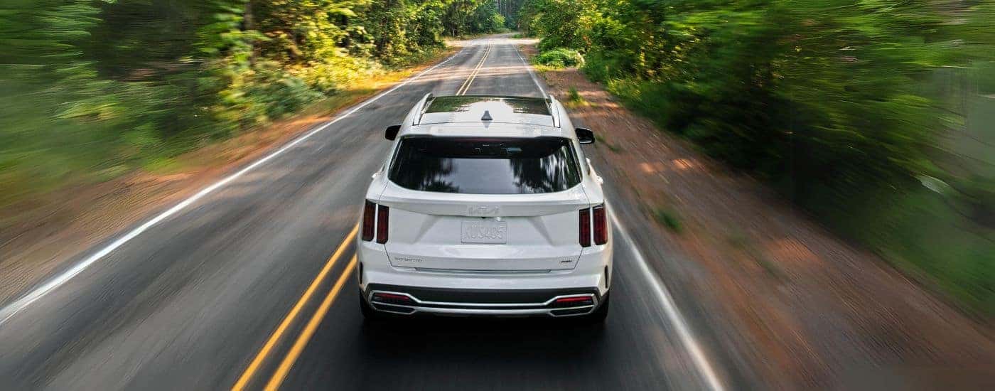 White 2022 Kia Sorento from the rear on an open road