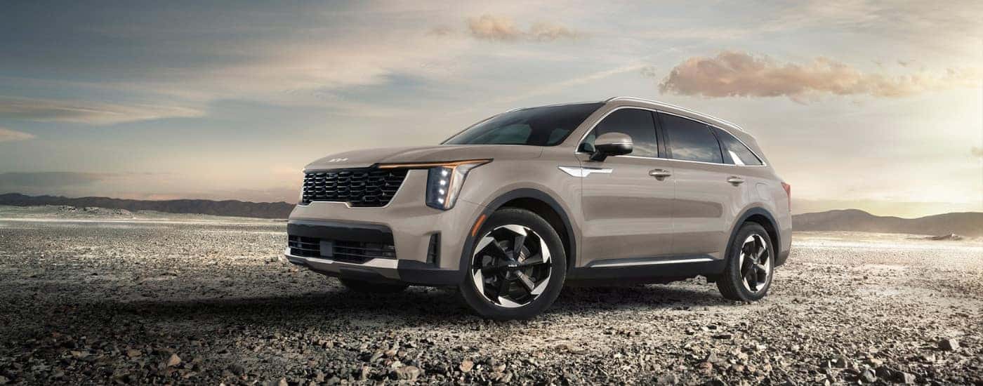 Tan 2026 Kia Sorento parked off-road at an angle