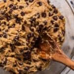 Chocolate Chip Cookie Batter in a bowl with a wooden spoon