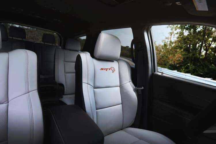 A close-up view of the 2025 Dodge Durango SRT Hellcat Hammerhead's seats featuring a stylish combination of white and black upholstery.