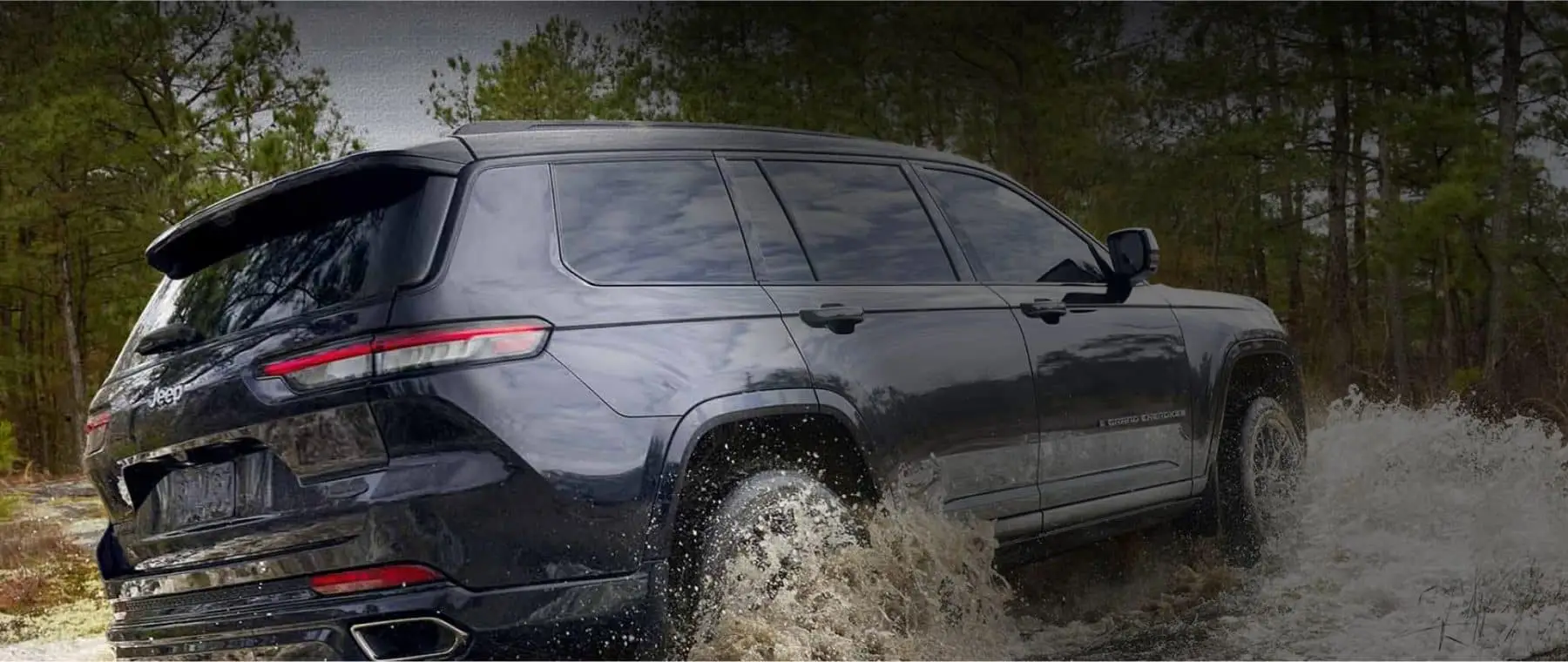 Jeep SUV driving through water