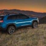 Cherokee on hill at sunset