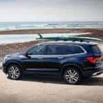 2018 Honda Pilot at the beach with surfboard