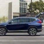 Couple loading their blue Honda CR-V