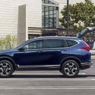 Couple loading their blue Honda CR-V
