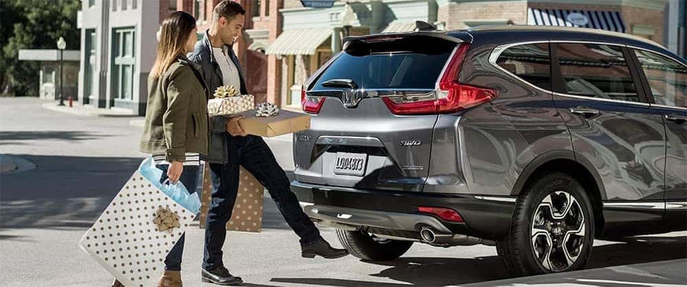 Couple Loading Presents into 2019 Honda CR V Cargo Area