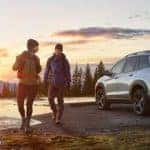 Couple hiking with Honda Passport