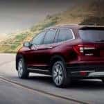 2019 Honda Pilot Dark Red Driving on curvy mountain highway