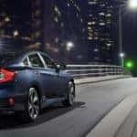 2020 Honda Civic driving fast in city at night