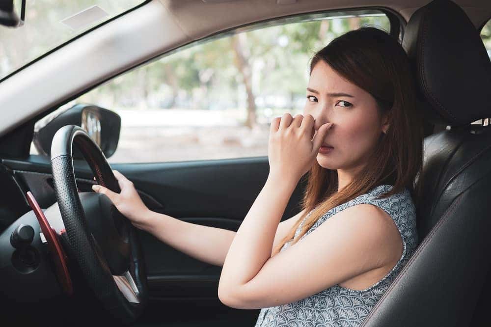 gas smell in car when stopped