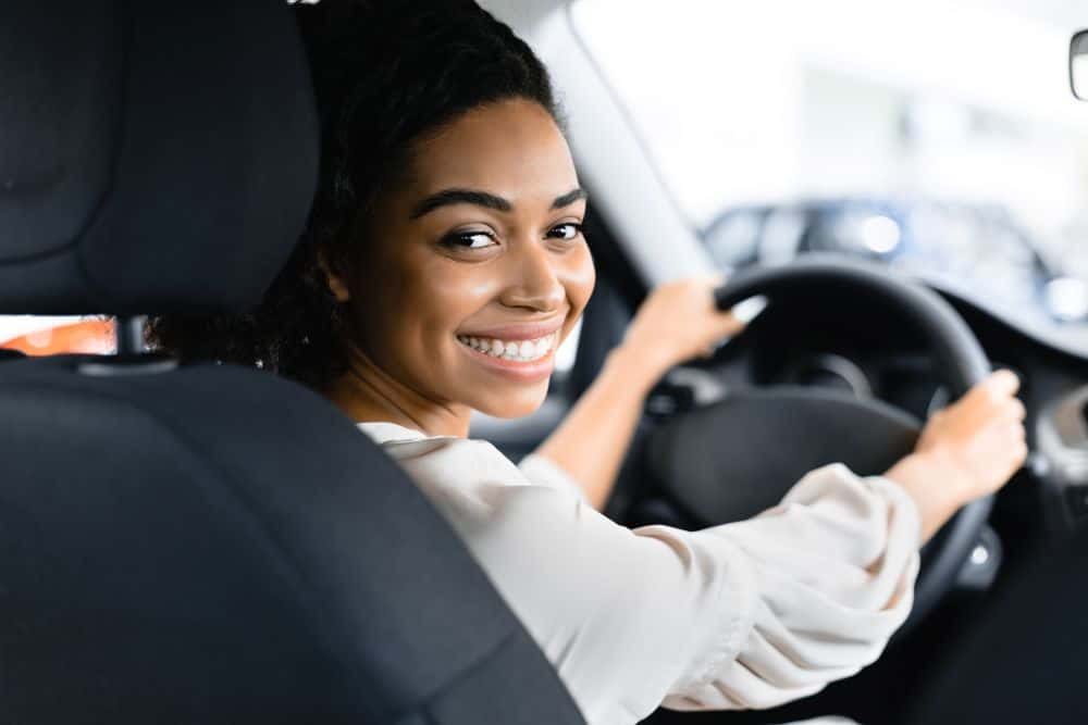 Young woman in car