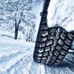 Car tires on snowy road