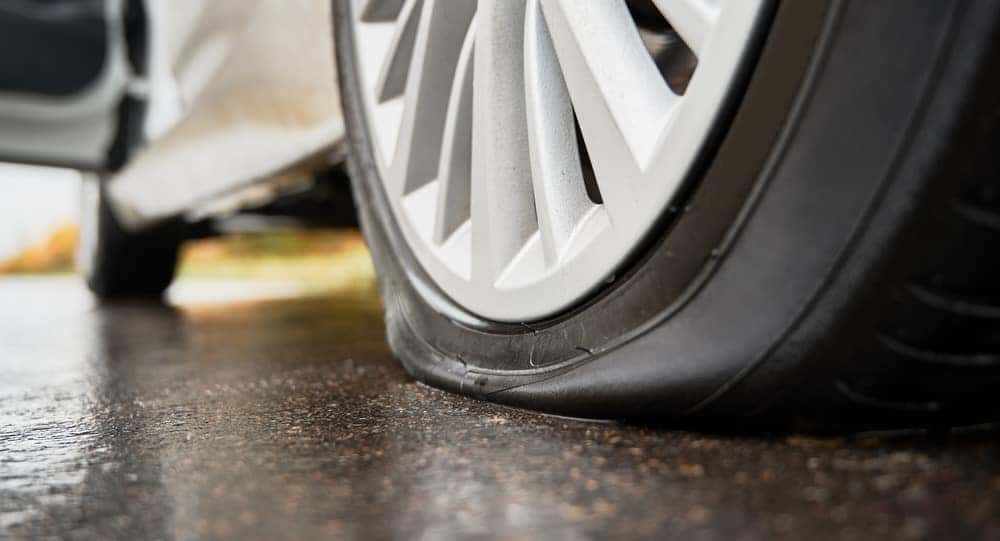 Tire on wet pavement representing alignment issues