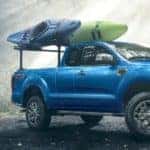 photo of a blue 2022 ford ranger in misty woods