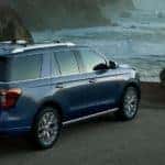 a 2023 ford expedition parked near a cliffside in cloudy weather